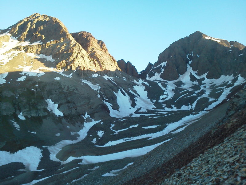 South face of Gladstone from the shoulder of Cross Mountain. Lucky Strike climbs to the highest snow in the center of the face, then up and right on the rock. East wall of Mount Wilson in the sun on the left.