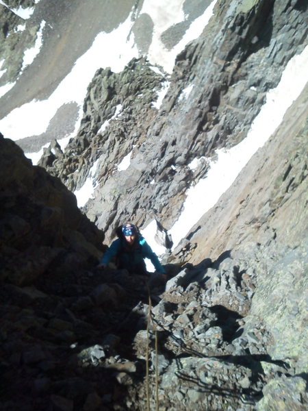 Jon Fike above the difficulties, looking down the middle of the South face. The upper headwall on the right.<br>
