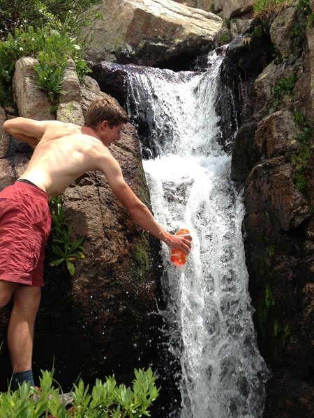 It doesn't get much better. A cold drink on the descent from Glacier Gorge.