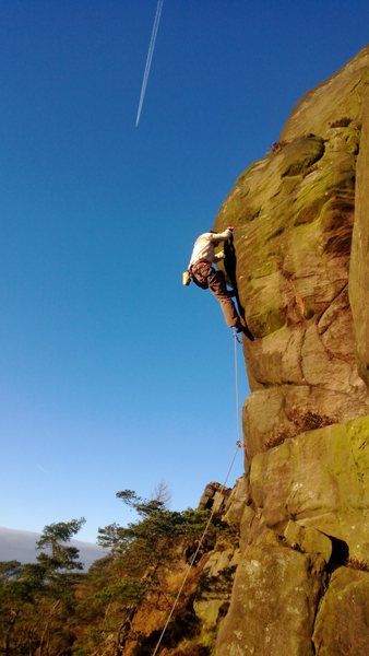 Grappling with the green slopers on Tower Face.