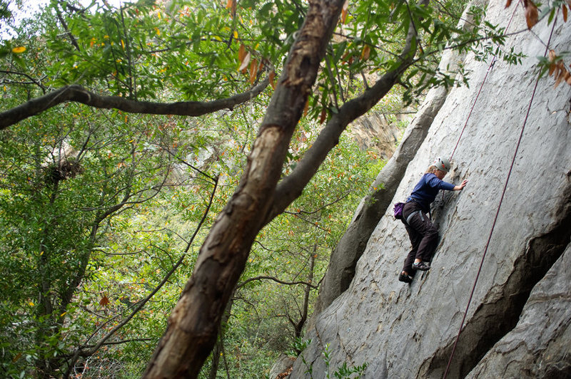 Nicole climbs Sword in the Stone, on the Renaissance Crag in Rattlesnake Canyon.