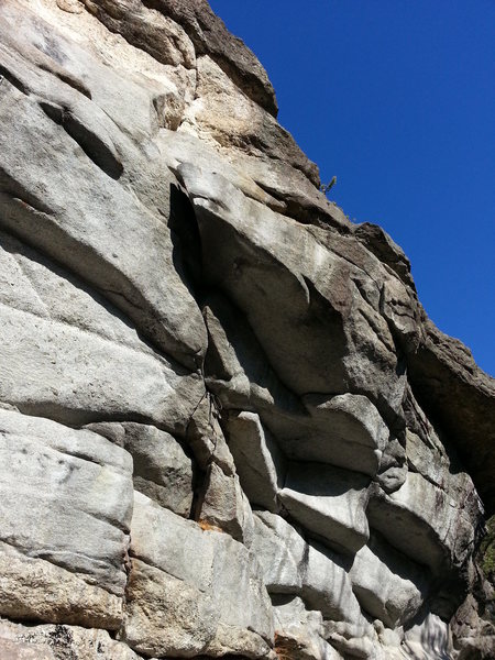 The route starts below the thread and heads left around the obvious flake