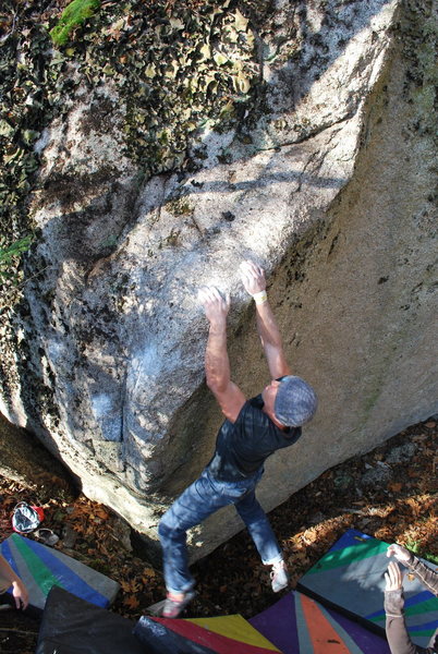 Emmanuel Hudon works a project left of The Eliminator on the Wander Boulder