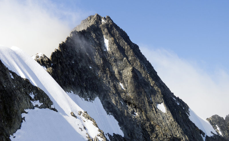 Upper portion of the North Ridge and Forbidden's summit as veiwed from the Col. The Northwest face variation is the prominent snow feature leading up to the ridge.