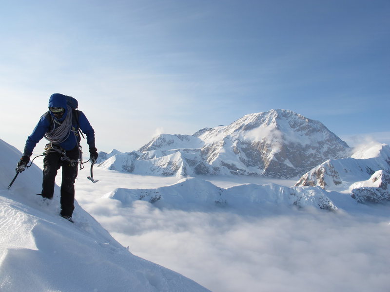Vito pulling in to the Cornice Bivy at 12,700' with the monumental South Face of Denali behind him.