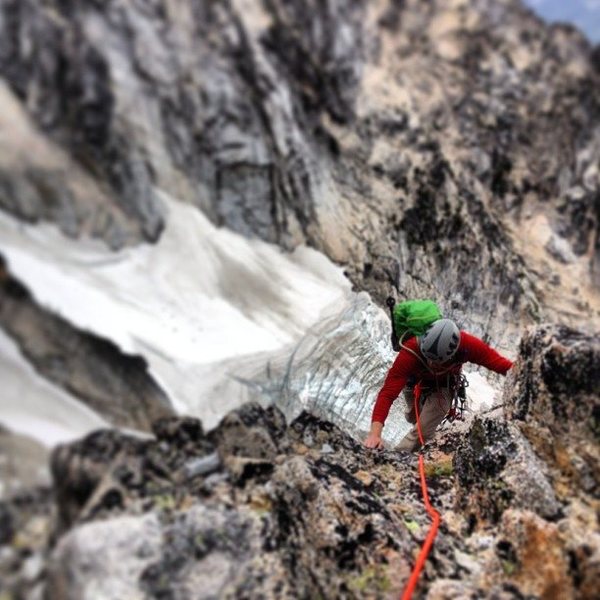 My brother Jimmy following a pitch on Serpentine Arete, Dragontail Peak, Enchantments, WA. Colchuck Glacier far below.
