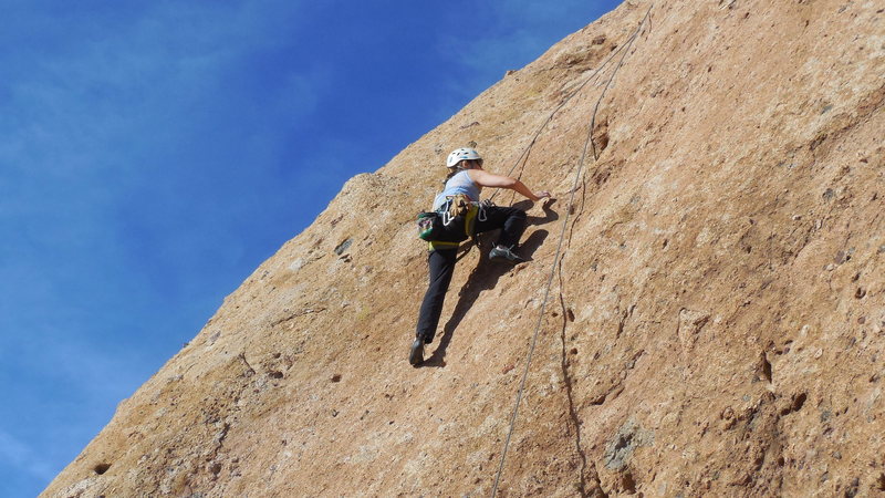 Climbing the delicate upper slab of "Don't Mess With Muleshoe."