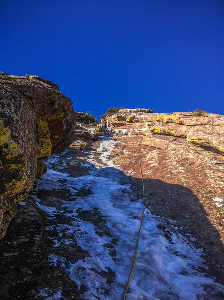 The second pitch, thin and disappearing quickly (12/13). We switched over to climbing shoes at this point and finished up and right.