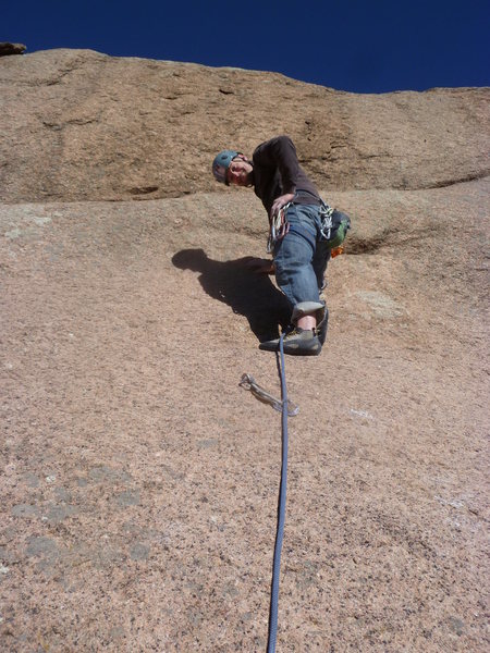 On the upper section above the first anchor.