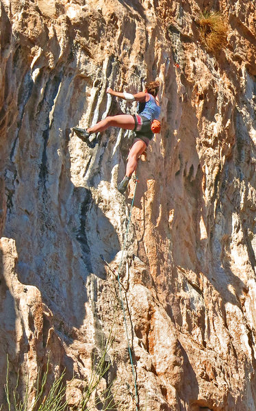 Marilla chugs through the tufa <br>
section before the crux<br>
Micro Burst (5.12a)