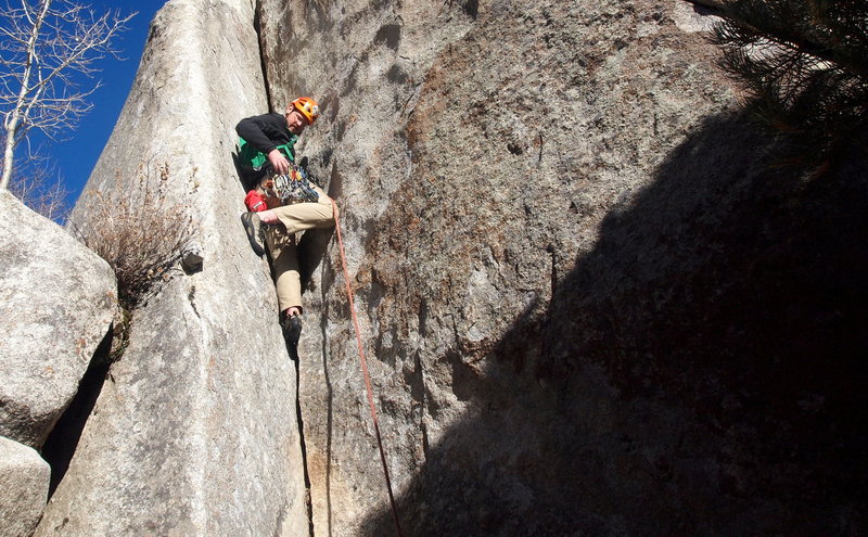 Garret climbing the opening dihedral/hand crack