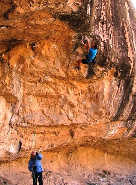 Clipping the fourth bolt between cruxes.