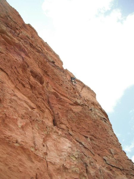 climber on P4. starts off in a crack and goes to face climbing and then another, fragile crack to the top! crux pitch