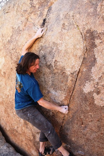 Reaching up to the better holds.