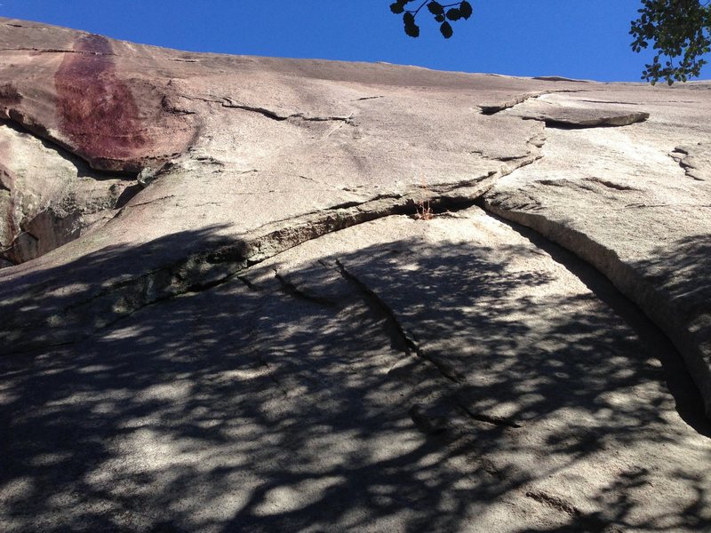 Face Value, 5.11d - Climbs strait up to the bolt directly under the Fleet Feet anchors then continues strait up to the anchors.