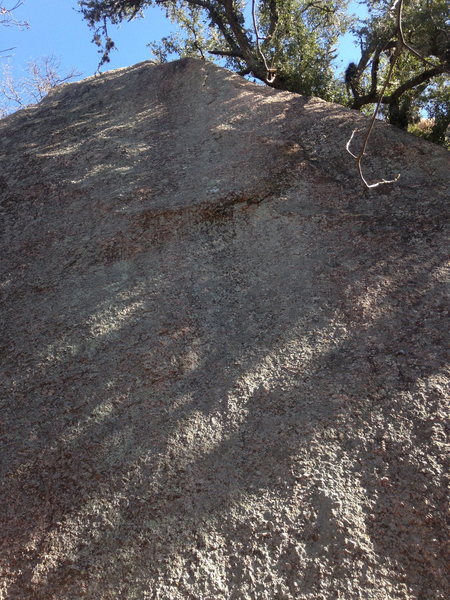 Event Horizon climbs the right side of the Lost Wall Boulder.