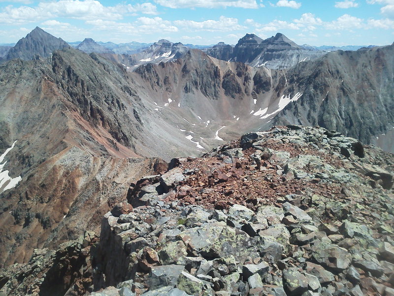 From Mears looking southeast back along the ridge line. S6 and S5 on the ridgeline left, S3 center. T.O. out of sight on the far right. Sneffels looming large back left, Dallas and West Dallas back center.