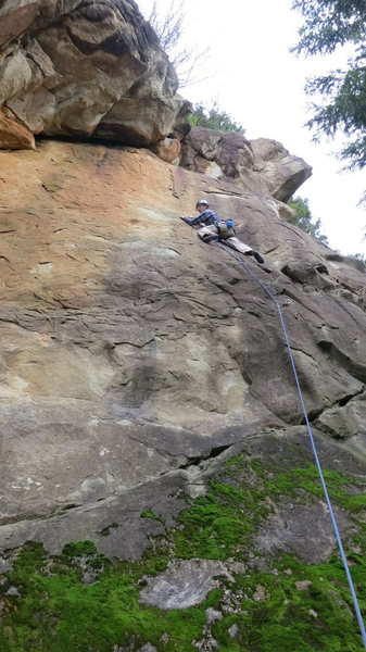 Follow crack up and right to the first bolt and continue up flakes and edges to chain anchor. Fantastic climbing. A direct start offers a fun and interesting boulder sequence.