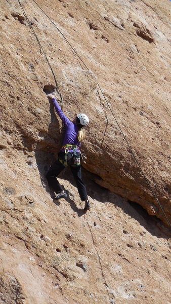 Reaching the hole on "Endymion." For those of short stature this may be the routes crux.