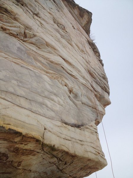 You can see the route by the path of the rope. Note, you start on the right side of the arete and step around.