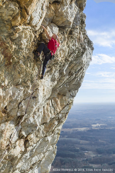 Stunning exposure and great climbing. Seth Tart on Jesus Christ Superstar. One of the most scenically photogenic routes in the state.