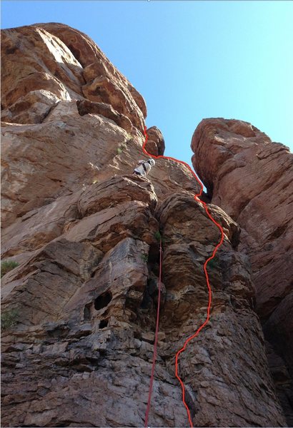 Easy ground through broken rock section, to ledge, to arete, to Sedona-like crack system to top. DAS eyeing the first crux to Raptor's Roof.