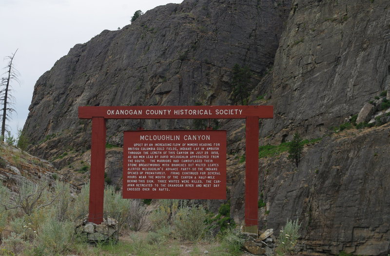 Roadside sign about Canyon's history (with the East Face of Main Canyon behind).