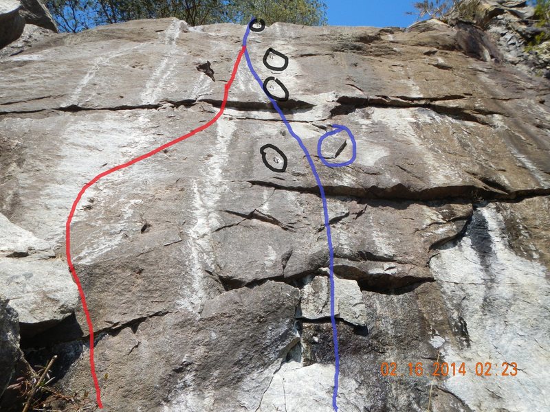 The intended start is shown in blue and the easier start is shown in red (more or less). Shorter climbers will find it difficult to start under the bolt as a critical hold is a little reachy (circled in blue).