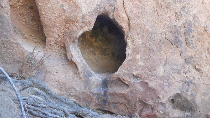 A unique hueco or solution pocket at the base of the west face of the Tower of Babel (aka the Ten Gallon Hat).