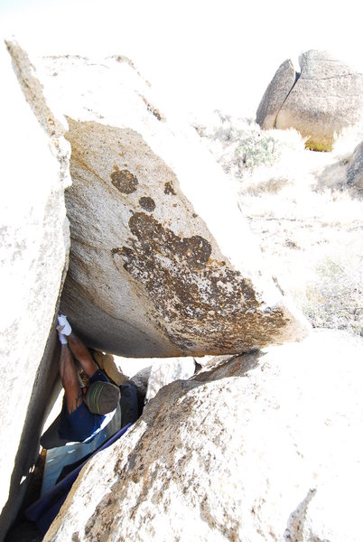 Climb the crack through the slot.