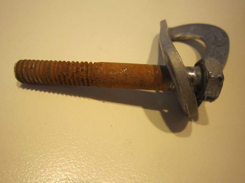 This bolt takes the bulk of falls on this 45 foot route. Damage to hanger is due to my trying to remove it and the parts below surface. That didn't work out so I drilled another hole.