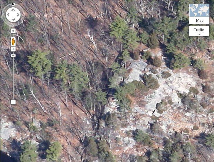 Again google maps, zoomed in. You see the top of the crag but the face is away from the camera so you can just make out the ridge line.