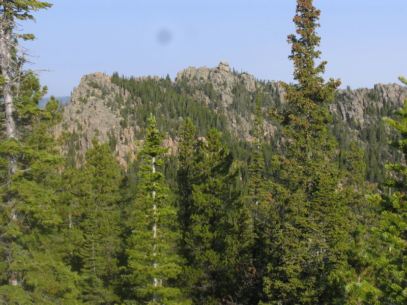 approximate elevation pt x9060 located in adjacent section 6 to the west of the Olin Lode.