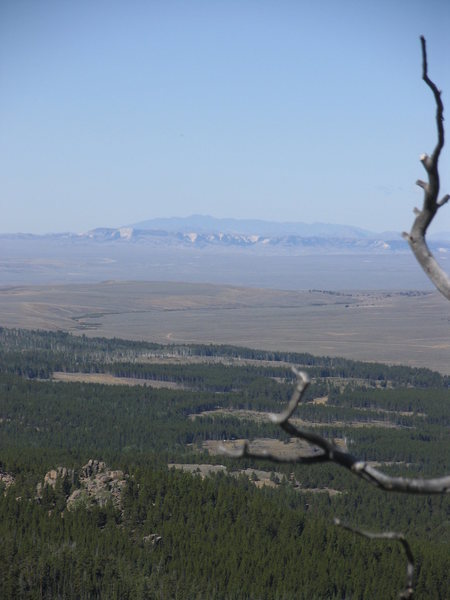Looking west across Shirley Basin from Warbonnet summit to the Ferris Mountains with the whites of the Chalk Mountains appearing below them.