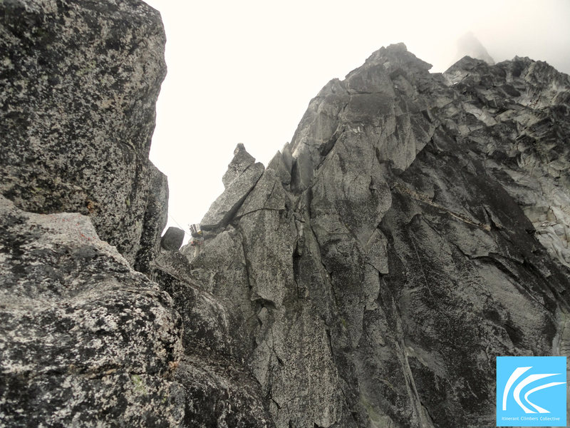 Can you spot the climber? A shot of me heading up one of the steeper steps on the North Ridge of Mt. Stuart. The crux of the route, The Great Gendarme, peeks through the fog above.