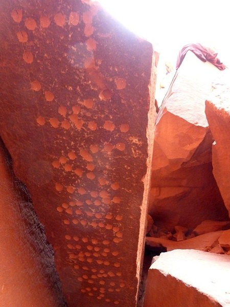 Annunaki name plaque, on the left underside of a huge block against the base of the route. Photo by Rick. 18 Apr 2014.