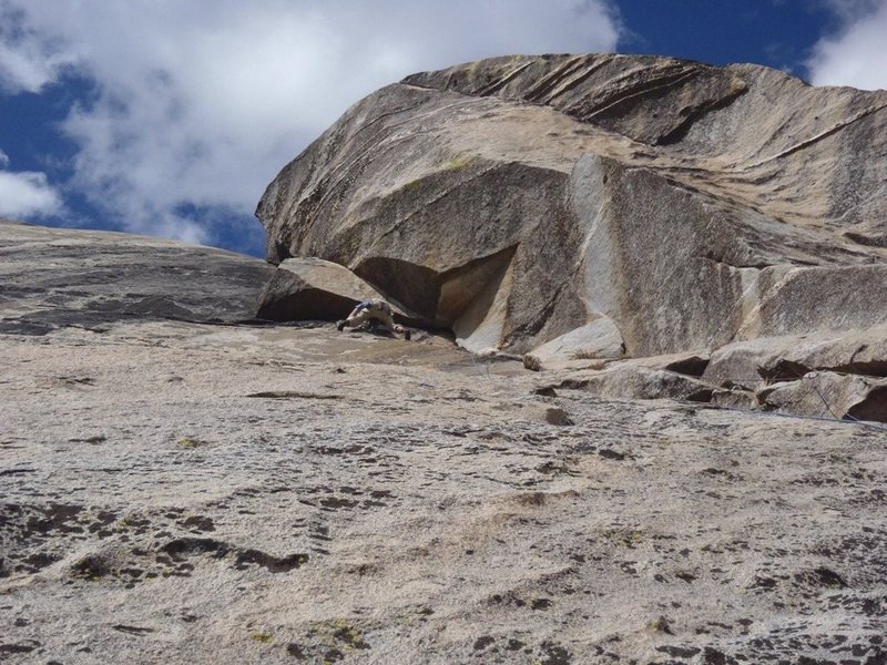 David B. post crux of the climb. Headed left to the bolt anchor just to the side of the formation overhead.<br>
<br>
Pitch 4 goes up the dihedral.