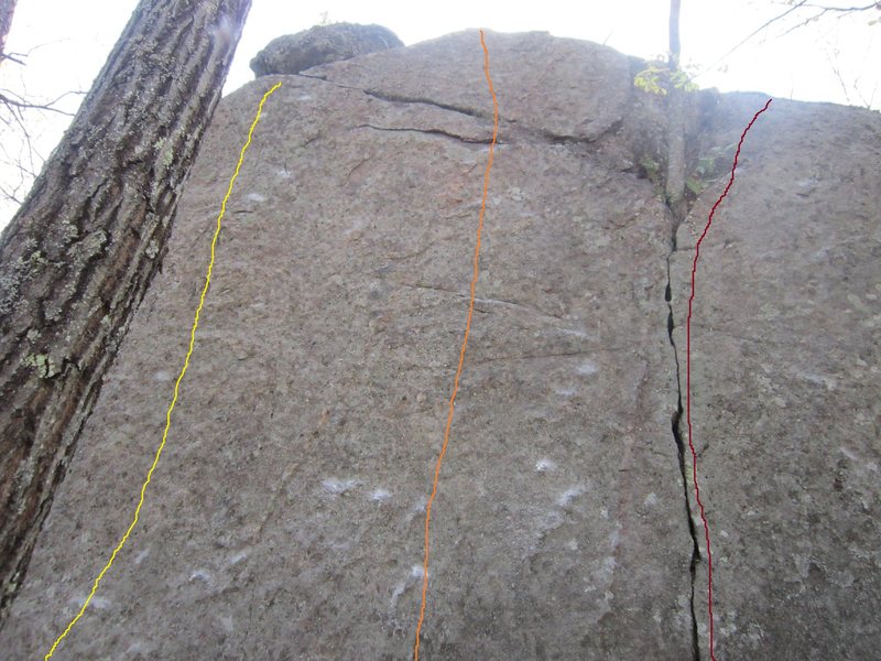 In the Moment (Orange) 5.10+. Delicate moves off the ground lead to a decent rail. *The flake is flexing**. A hidden jug provides security for the top out.<br>
Crack is 5.7.<br>