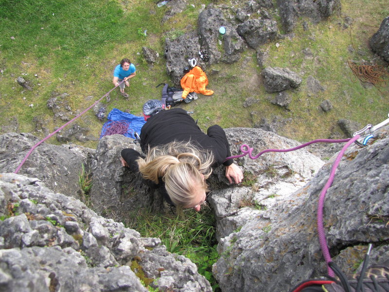 Fanny mantling up to the ledge prior to the top-out.