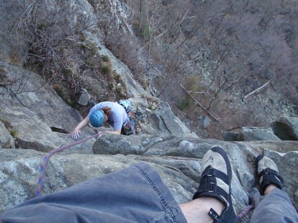 Random example i found on my computer of me top belaying as described - in this case, the anchor is two trees behind me.<br>
<br>
(Top of P3 - Gelsa, The Near Trapps, The Gunks)