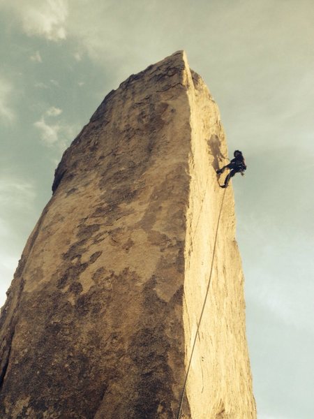 Ramon rapping off the back side of Headstone after climbing Cryptic in some spicy high winds.