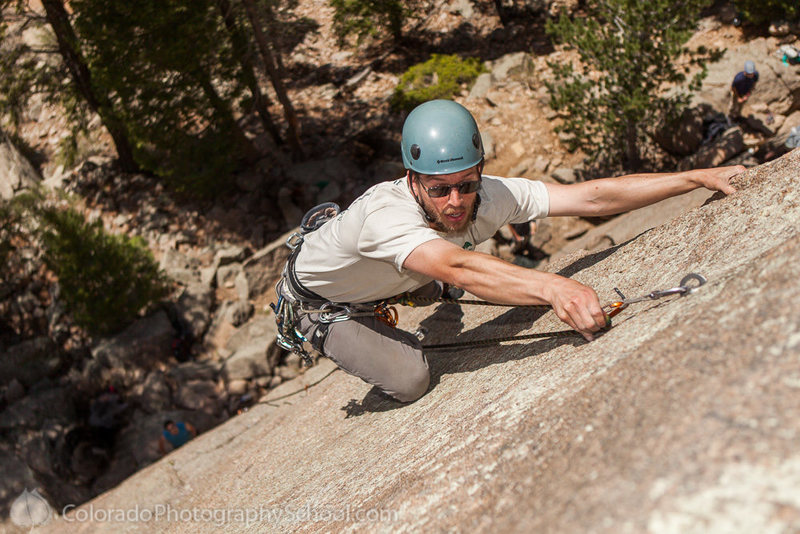 Brian Rowe clipping the last bolt.