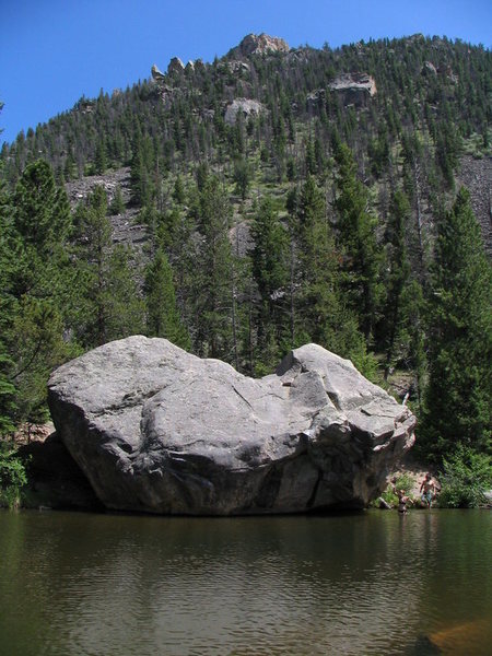 The Bog boulder in summer. Iron Helix starts in the dihedral on the right-hand side of the boulder and moves left.