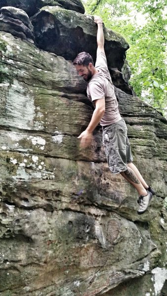 Hanging at the top of Dollar Bills - V2 at Bear Rock Lake boulders