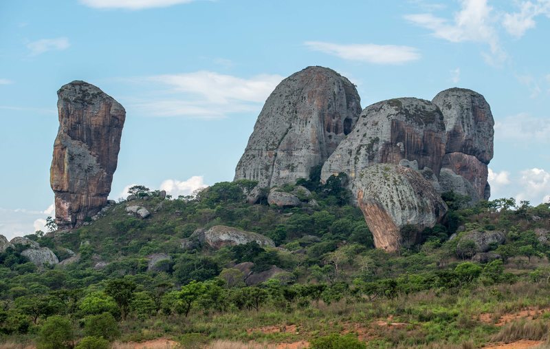 Torre N'lundi is the far left tower. View from start of dirt road on approach.