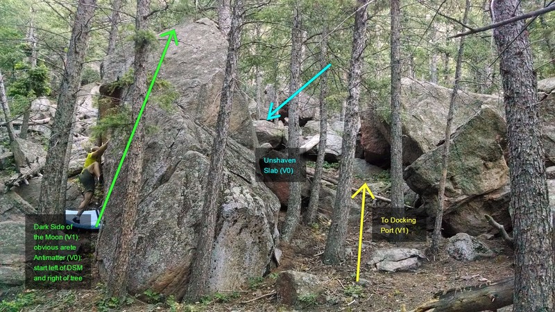 Docking Port on left of two 10 ft tall boulders behind the boulder containing Dark Side of the Moon (V1) and Antimatter (V0).