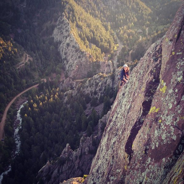 Kasi Phanara cleaning up the exposed arete on the last pitch of the Yellow Spur. Summer 2014.