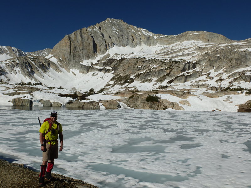 Barry near frozen-over Steelhead Lake, North Peak's North Face in view. Northwest Ridge on right skyline.