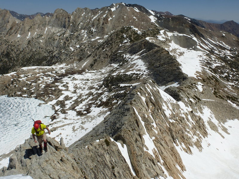 Barry on NW Ridge, looking north with Upper McCabe Lake below.<br>