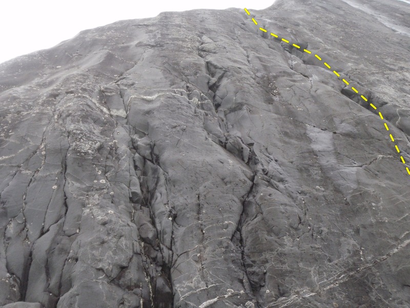 Black Pudding starts just out of frame and climbs the sloping holds stright to the anchor.